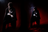 A very dark, almost black image with an extremely dim, reddish light source barely visible in the bottom right.